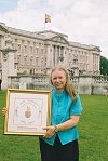 Fiona delivering a framed Jubilee 2002 gift piece